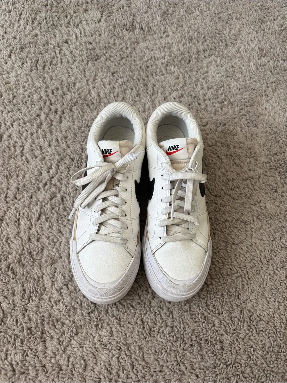 Nike White Low-Top Sneakers with Black Swoosh and Tan Trim